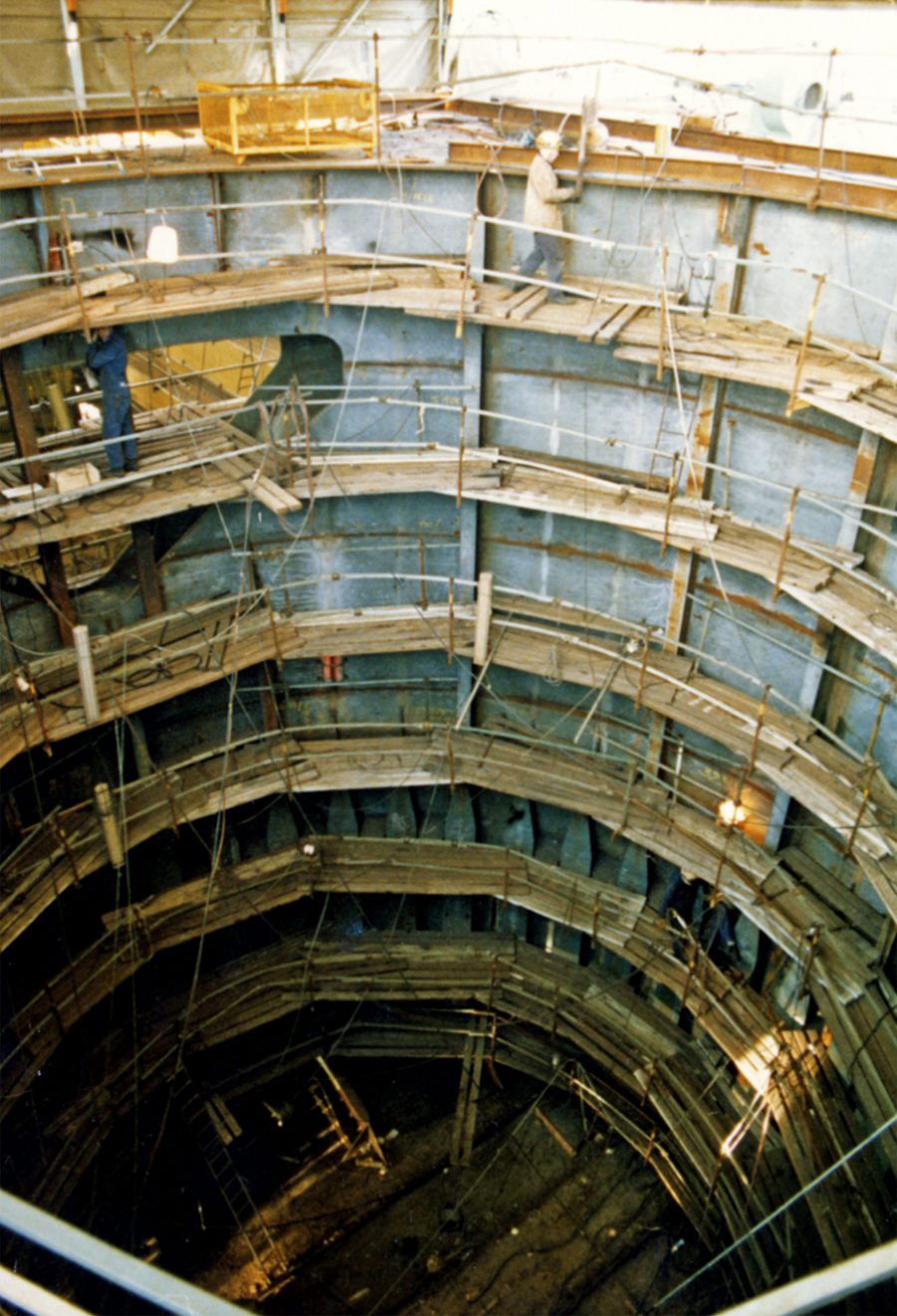 Inside a Condeep shaft during construction with workers on scaffolding
